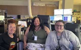 Three women with phone headsets